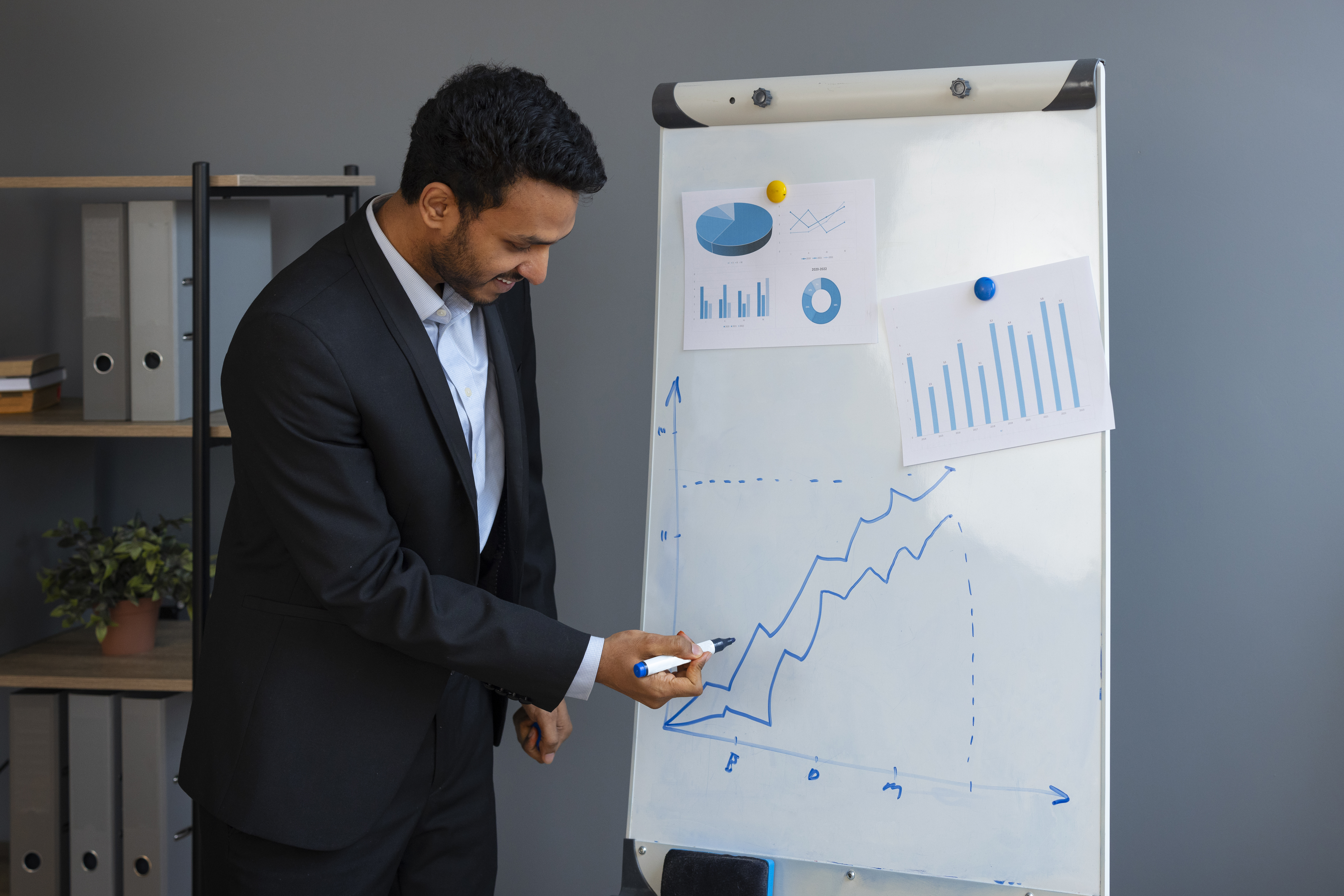 Young man explaining data to customer