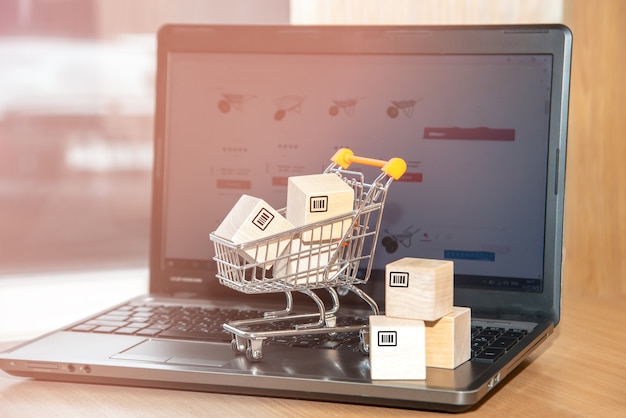 eCommerce cart placed on top of laptop